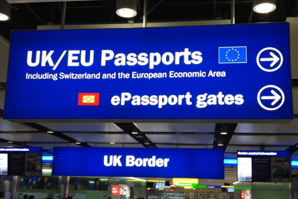 UK border-control signs at Heathrow; contextual file photograph.